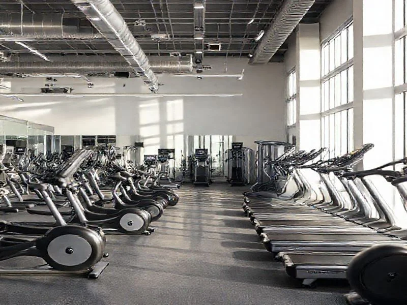 Abstract image representing smart resistance training, with glowing circuits and data visualizations overlaying a sleek, dark machine surface. No human figures.